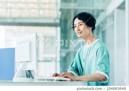 Young engineer working in the office 104063649