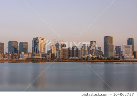 Evening view of Umeda from the Yodogawa riverbed in Osaka Evening view of Umeda from the Yodogawa riverbed in Osaka 104063737