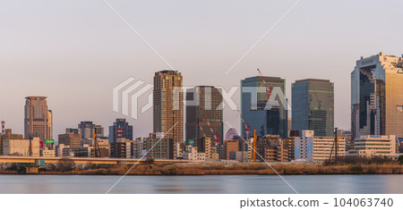Evening view of Umeda from the Yodogawa riverbed in Osaka 104063740