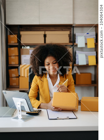 Small business entrepreneur SME freelance woman working at home office, BOX,tablet and laptop online, marketing, packaging, delivery, e-commerce concept. Small business entrepreneur SME freelance woman working at home office, BOX,tablet and laptop online, marketing, packaging, delivery, e-commerce concept. 104064304