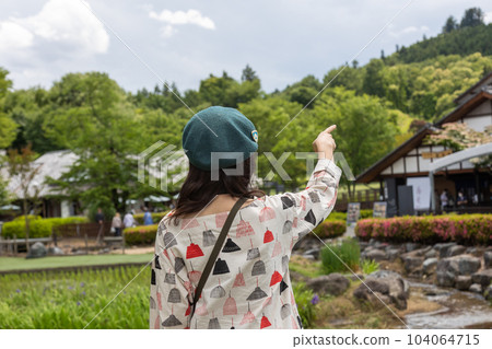 Tourist woman strolling through Roadside Station Den-en Plaza 104064715