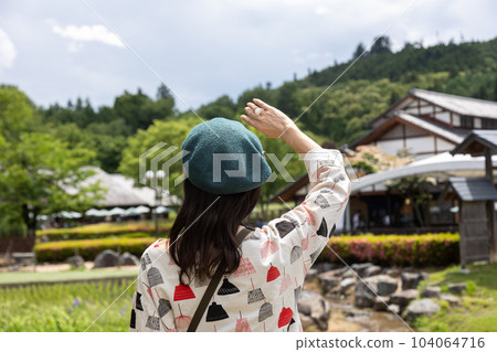 Tourist woman strolling through Roadside Station Den-en Plaza 104064716