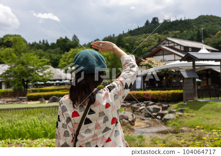 Tourist woman strolling through Roadside Station Den-en Plaza 104064717