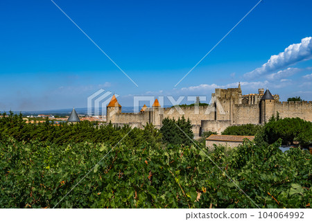 Spectacular Ancient Fortress Of Medieval City Carcassonne And Vineyards In Occitania, France 104064992