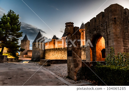 Spectacular Illuminated Ancient Fortress Of Medieval City Carcassonne In The Night In Occitania, France Spectacular Illuminated Ancient Fortress Of Medieval City Carcassonne In The Night In Occitania, France 104065285