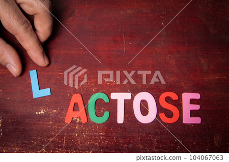 LACTOSE. Health Concept. Text from colorful wooden letters 104067063