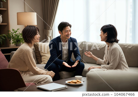 A saleswoman explaining to a couple, generated AI 104067466