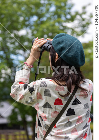Female tourist birdwatching at Michi-no-Eki Den-en Plaza Female tourist birdwatching at Michi-no-Eki Den-en Plaza 104067700