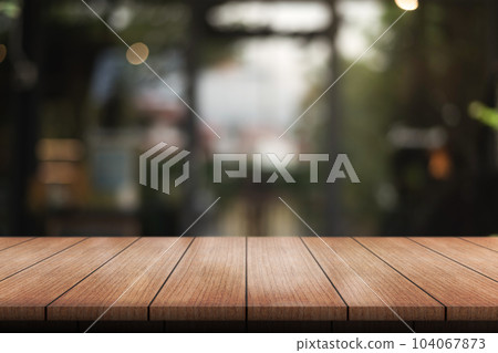 Empty wooden table top with lights bokeh on blur restaurant background. 104067873