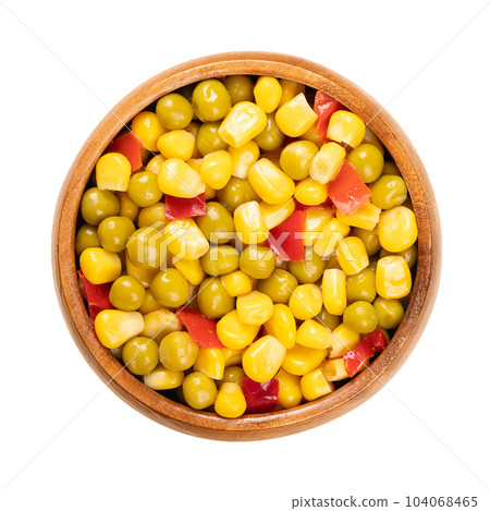 Mix of canned corn, green peas and diced red bell pepper, in a wooden bowl. Ready to eat Mexican maize mix, as a side dish to a barbecue. Isolated, from above, close-up, over white, macro food photo. 104068465