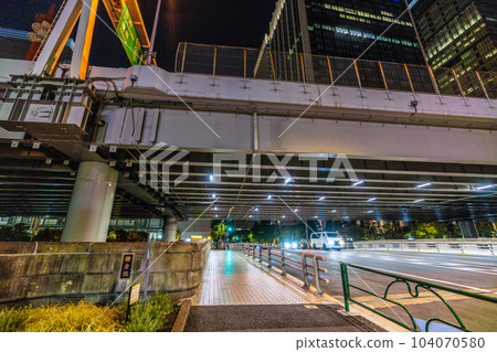 The cityscape of Tokyo, Japan, overlooking Kamakura Bridge at night. The Tokyo Metro Marunouchi Line runs underground. The back of the bridge is on the Otemachi side 104070580