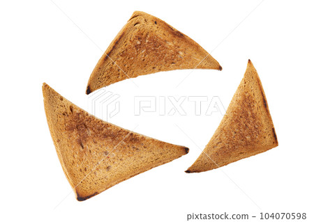 Several slice of lightly toasted bread isolated on a white background. Sliced toast bread. 104070598