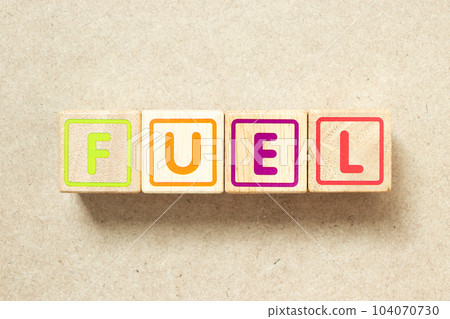 Wooden alphabet letter block in word fuel on wood background Wooden alphabet letter block in word fuel on wood background 104070730