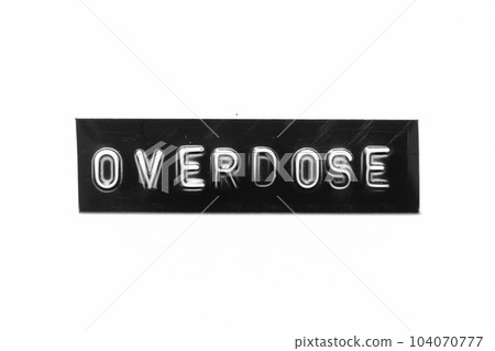 Black color banner that have embossed letter with word overdose on white paper background Black color banner that have embossed letter with word overdose on white paper background 104070777