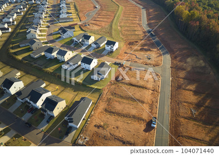 Ground prepared for building of new residential houses in South Carolina suburban development area. Concept of growing american suburbs 104071440