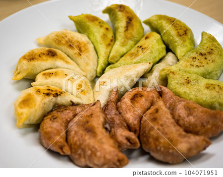 Deep-fried gyoza in a plate Deep-fried gyoza in a plate 104071951