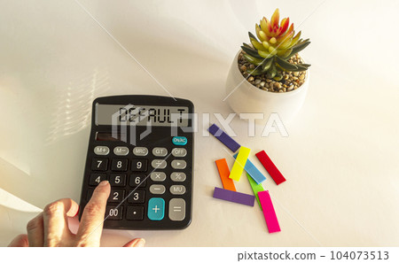 By default, the text is written on the calculator display. Female hand lies on calculator 104073513