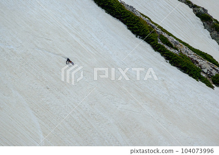 A snowboarder gliding down Kenzawa A snowboarder gliding down Kenzawa 104073996