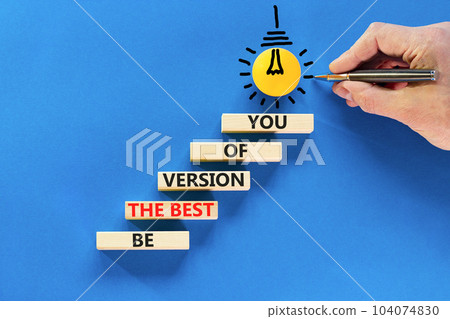 Motivational and inspirational symbol. Concept words Be the best version of you on wooden block. Beautiful blue background Businessman hand. Business motivational inspirational concept. Copy space. Motivational and inspirational symbol. Concept words Be the best version of you on wooden block. Beautiful blue background Businessman hand. Business motivational inspirational concept. Copy space. 104074830