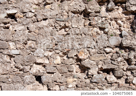 Rough stone wall background 104075065