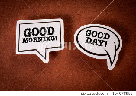 GOOD MORNING and GOOD DAY. Speech bubbles with text on a brown background 104078995