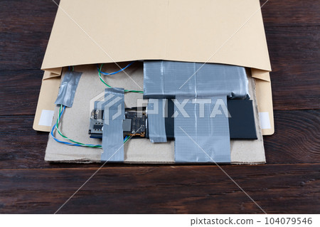 Hand made Improvised Explosive Device with plastic explosive C-4 and cell phone module in envelope 104079546