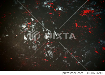 Black background with red, white, gray and blue strokes, dashes, stains and scuffs. A ray of light 104079690