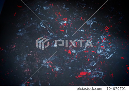 Black background with red, white, gray and blue strokes, dashes, stains and scuffs. A ray of light Black background with red, white, gray and blue strokes, dashes, stains and scuffs. A ray of light 104079701