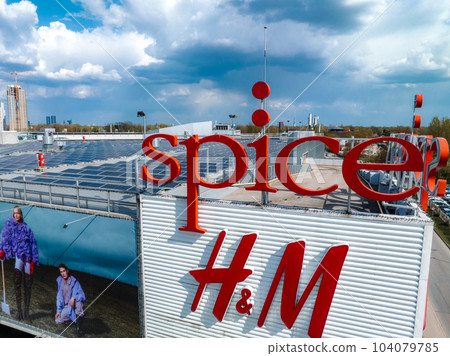 Aerial view of the Spice shopping mall in Riga, Latvia. Roof is covered with solar panels. Aerial view of the Spice shopping mall in Riga, Latvia. Roof is covered with solar panels. 104079785