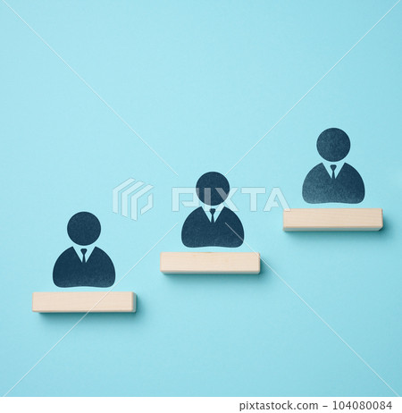 The concept of leadership in business, the rating of talented employees. Wooden bars and staff icons on blue background 104080084