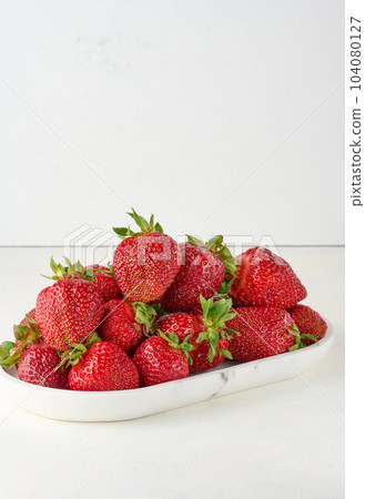 Ripe red strawberry on white background 104080127