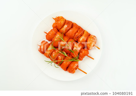 Closeup of chicken meat.Procurement for designers.Fresh raw marinated chicken leg meat skewers without skin on a white background.Marinated Fresh.Chicken Skewers meat. Closeup of chicken meat.Procurement for designers.Fresh raw marinated chicken leg meat skewers without skin on a white background.Marinated Fresh.Chicken Skewers meat. 104080191