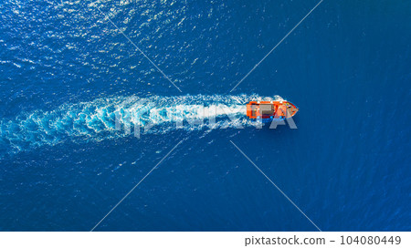 Vacation and leisure. Aerial view on fast boat on blue Mediterranean sea at sunny day. Vacation and leisure. Aerial view on fast boat on blue Mediterranean sea at sunny day. 104080449