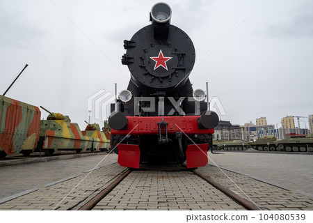 russian black retro train against a gloomy sky 104080539