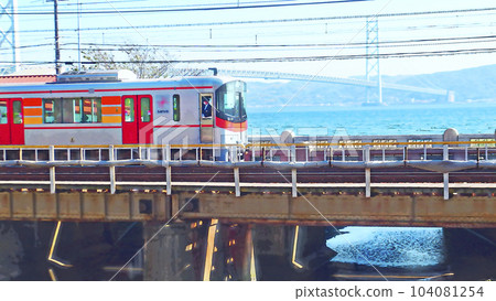 Running scenery of Sanyo train Near Nishi Maiko Akashi Kaikyo Bridge background [horizontal composition] 104081254