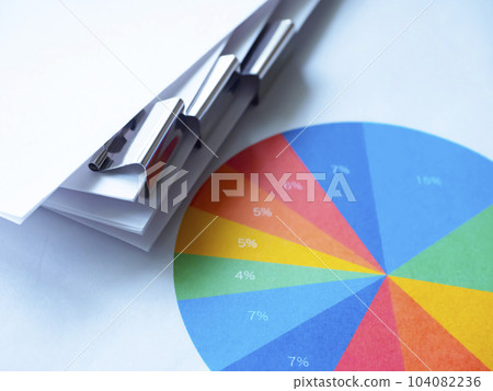 Graphs and documents on the table Graphs and documents on the table 104082236