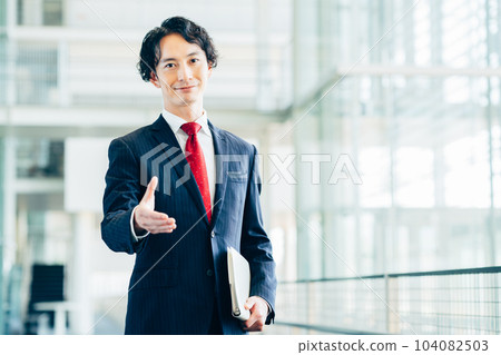 Businessman shaking hands in the office Businessman shaking hands in the office 104082503