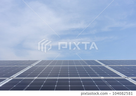 Monocrystalline solar panels lined up under a clear blue sky Monocrystalline solar panels lined up under a clear blue sky 104082581