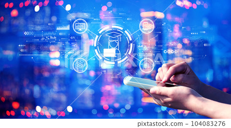 Distance learning theme with person using a smartphone at night 104083276