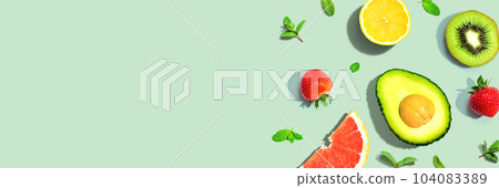 Avocado and mixed fruits overhead view 104083389