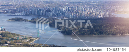 Stanley Park, Lions Gate Bridge and Downtown City on West Coast of Pacific Ocean. Aerial. 104083464