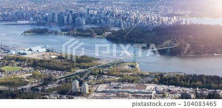 Stanley Park, Lions Gate Bridge and Downtown City on West Coast of Pacific Ocean. Aerial. 104083465