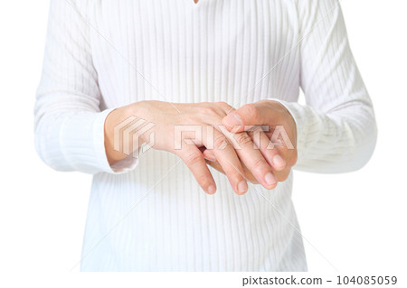 man touching wrist and thumb He squeezed his thumb and wrist. He had a tendon injury. wrist arthritis and having pain in the fingers and locked fingers 104085059