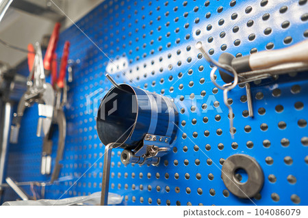 Tools of Car mechanic for a new piston for the engine, overhaul. Interior of a car repair shop. Tools of Car mechanic for a new piston for the engine, overhaul. Interior of a car repair shop. 104086079