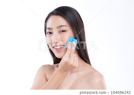 Beautiful Attractive Asian woman using Facial oil clean film to removal oily on face for face fresh skin feeling so fresh and clean,Beauty Self Care Concept,Isolated on grey background Beautiful Attractive Asian woman using Facial oil clean film to removal oily on face for face fresh skin feeling so fresh and clean,Beauty Self Care Concept,Isolated on grey background 104086242