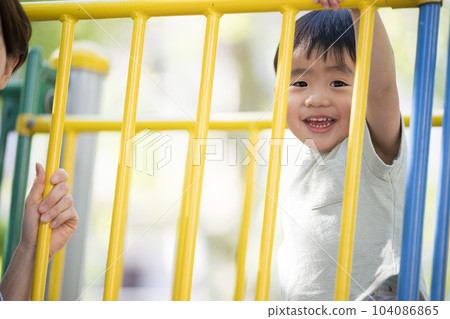 Close-up of a cute toddler playing with playground equipment Copy space available Close-up of a cute toddler playing with playground equipment Copy space available 104086865