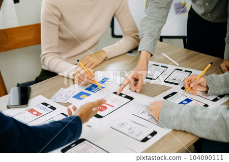 UX graphic designer planning application process development prototype wireframe for web smart phone. Creative digital development agency. in office UX graphic designer planning application process development prototype wireframe for web smart phone. Creative digital development agency. in office 104090111