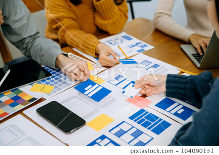 UX graphic designer planning application process development prototype wireframe for web smart phone. Creative digital development agency. in office 104090131