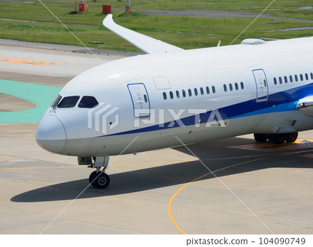 Airplane landing on airport runway Airplane landing on airport runway 104090749
