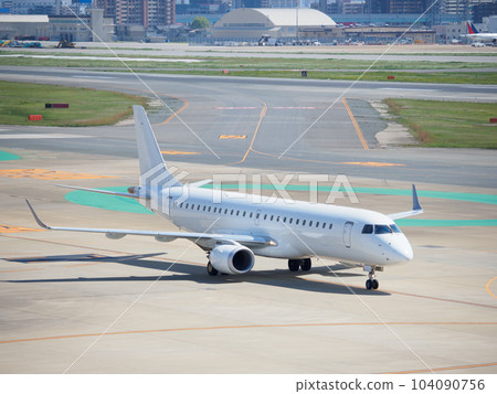 Airplane landing on airport runway Airplane landing on airport runway 104090756